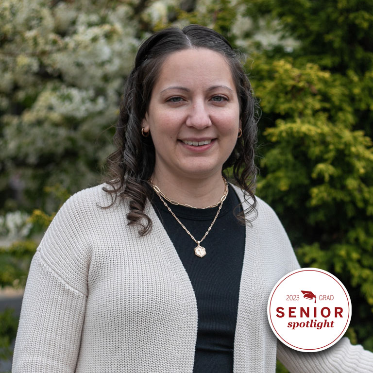 A woman smiles for a picture