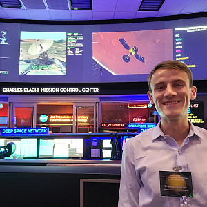 Brandon poses in the Charles Elachi Mission Control Center at the Space Flight Operations Facility (SFOF), aka, the Center of the Univers...
