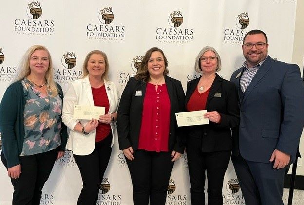 Josie Hatfield, Megan Hicks, Dr. Kelli Bernedo, and Dr. Donna Albrecht accept their grant checks from Josh Kornberg, Executive Director o...