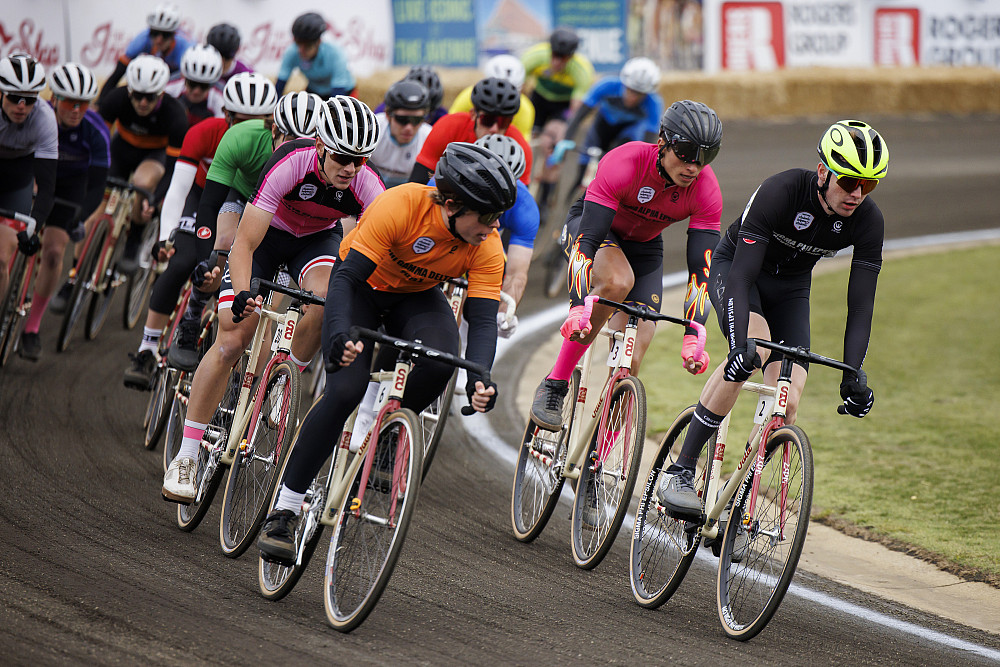 Sigma Phi Epsilon rider Will Pitts, right, leads a pack into turn four during the 2023 Men's Little 500. (Photo by James Brosher/Indiana ...
