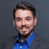 Conner Becker-Chamberlin, with University Communications & Marketing, poses for a photograph at IUPUI. The photo was taken at Univers...