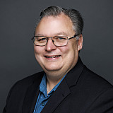 University Communications and Marketing staff member Vic Ryckaert poses for a portrait in studio at the Cyberinfrastructure Building on M...