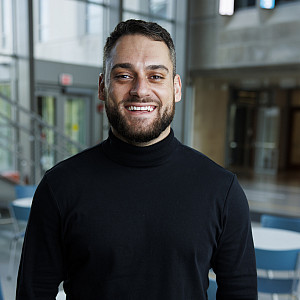 A man in a black turtleneck