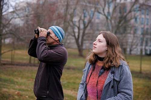 Alex Jahn, left, co-director of IU's Midwest Center for Biodiversity, and IU junior Katherine Johnson look for American robins on the Blo...