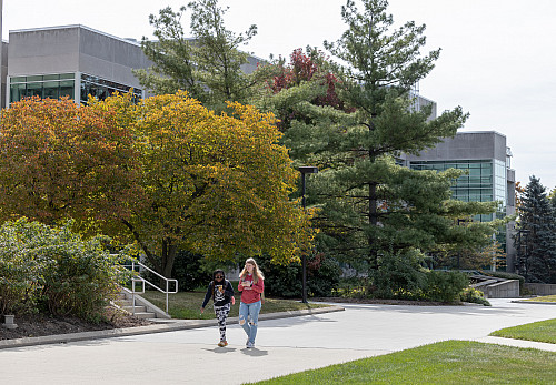 Two students walk on the IU Northwest campus
