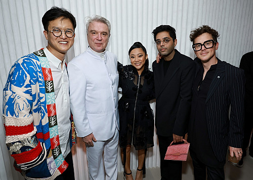 Ian Chang, Rafiq Bhatia and Ryan Lott of Son Lux with David Byrne and actress Stephanie Hsu at a cocktail party hosted by Vanity Fair and...