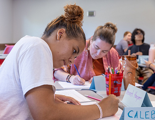 Nevaeh Harper and Carolyn Blank participate in an empathy research exercise during their Design Your Life and Career class at IU Blooming...