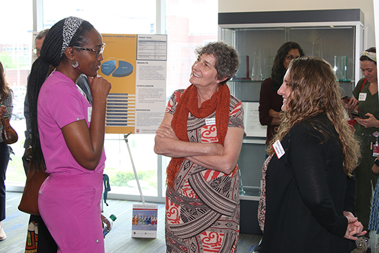 A pediatric resident discusses her project work during the 2023 Global Health Scholars Day event in Indianapolis. Photo courtes...
