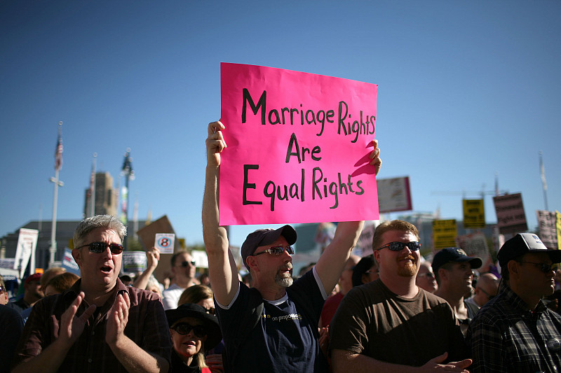 A supporter of gay marriage holds a sign saying Marriage Rights Are Equal Rights during a rally against the passing of Prop. 8 on Novembe...