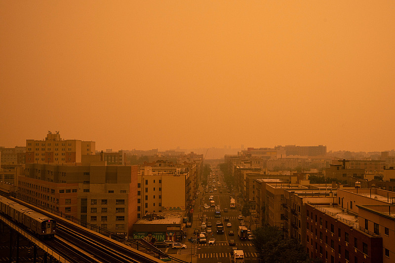 A smoky yellow haze from wildfires in Canada blankets a neighborhood in the Bronx borough of New York City.
