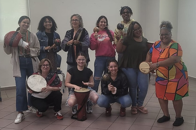 Students pose with Latin American instruments