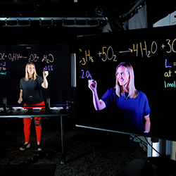 A woman works on an interactive online screen.