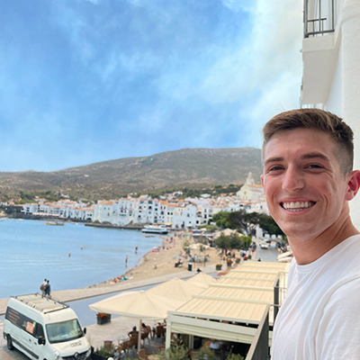 Garrett Wolf standing in Costa Brava, Spain.