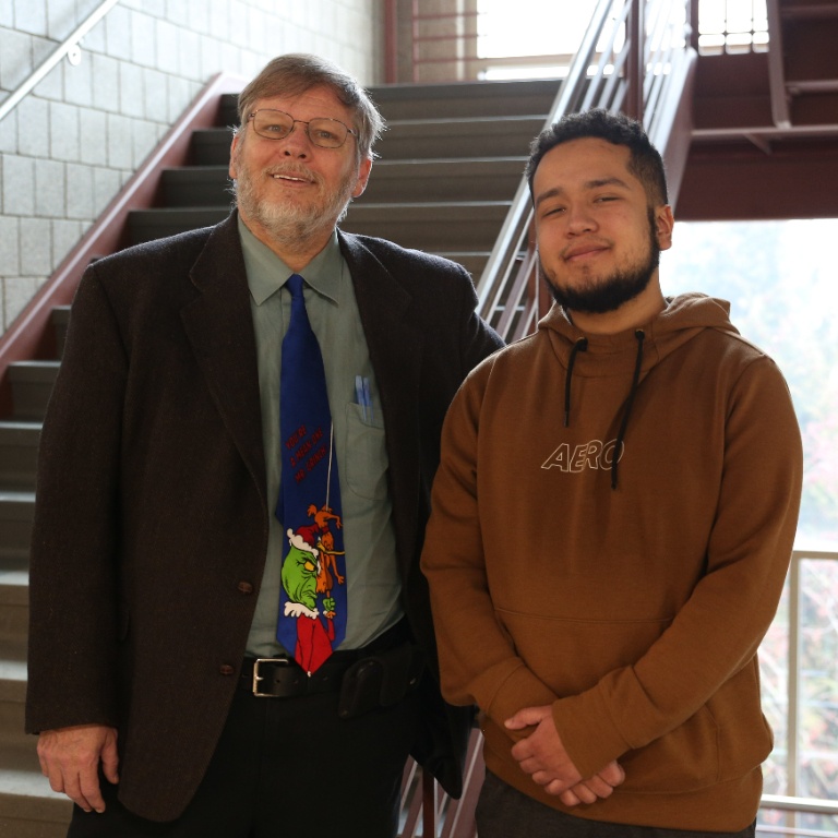Dr. Eric Lambert (left) stands alongside student researcher Job Gutierrez.