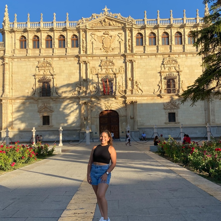 Cindy Torres poses in front of the old Universidad de Alcala building, which dates back to the 16th century.
