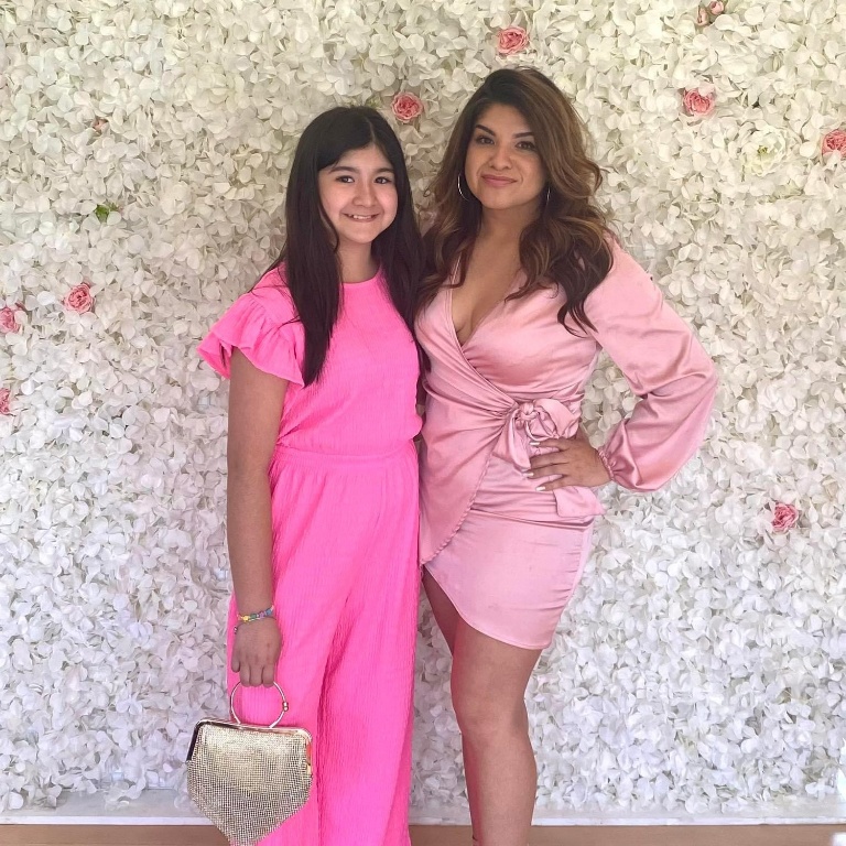 IU Northwest graduate student Leticia Lopez (right) takes a photo with her daughter.