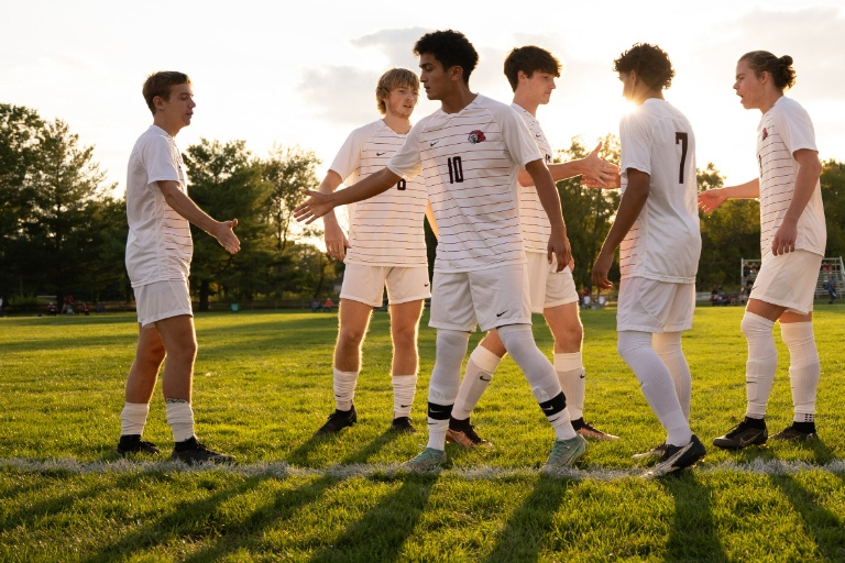Soccer players shake hands