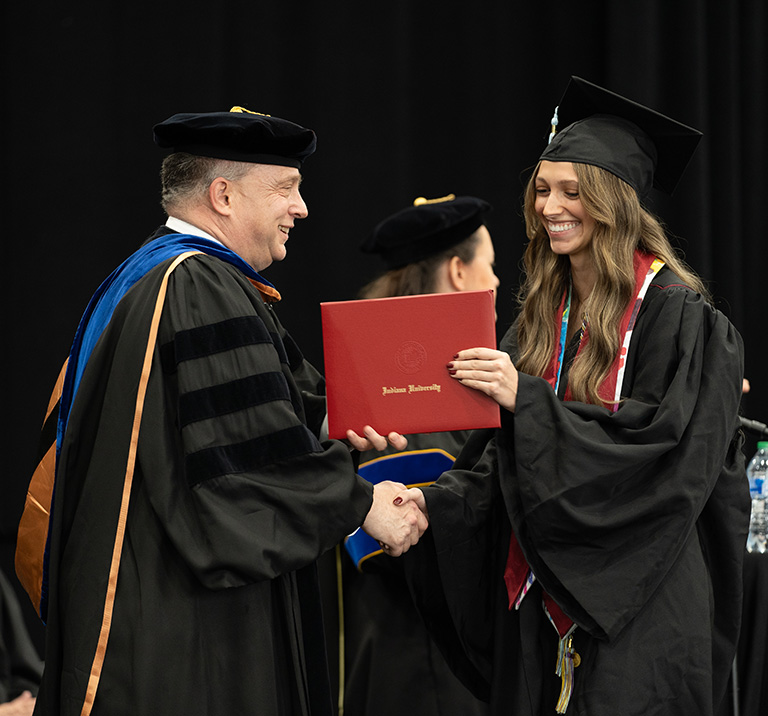 Dr. Hill with Graduate