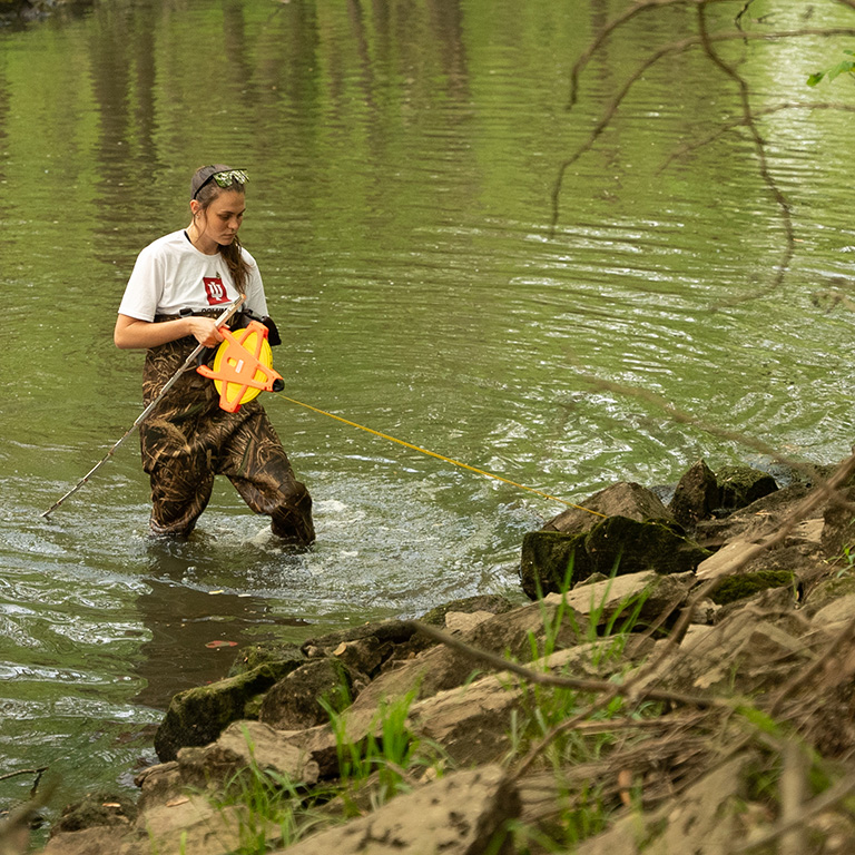 Woman does water monitoring