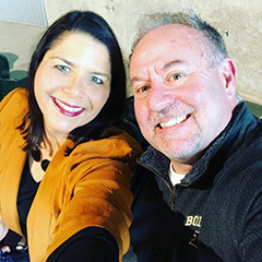 Two people smiling for a selfie