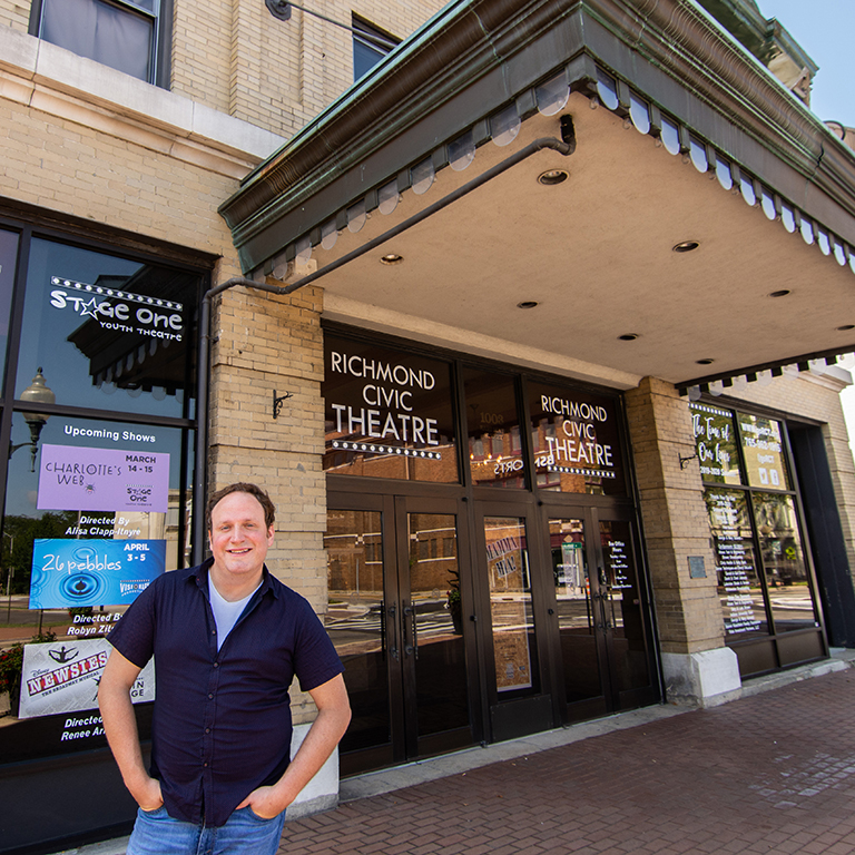 Ryan Shaw standing with hands on hips in front of Richmond Civic Theatre