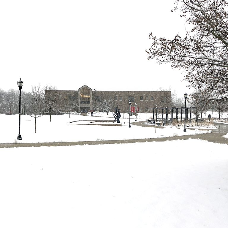 IU East quad in winter with a white sky and matching snow-covered ground