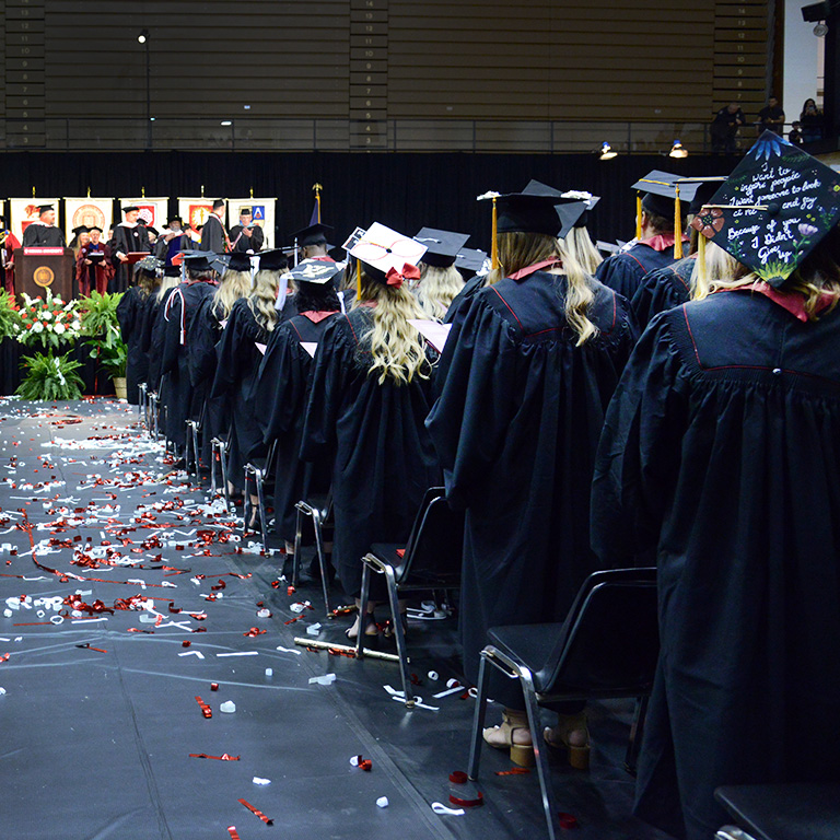 2019 graduates stand in the Richmond High School Tiernan Center during the Commencement Ceremony