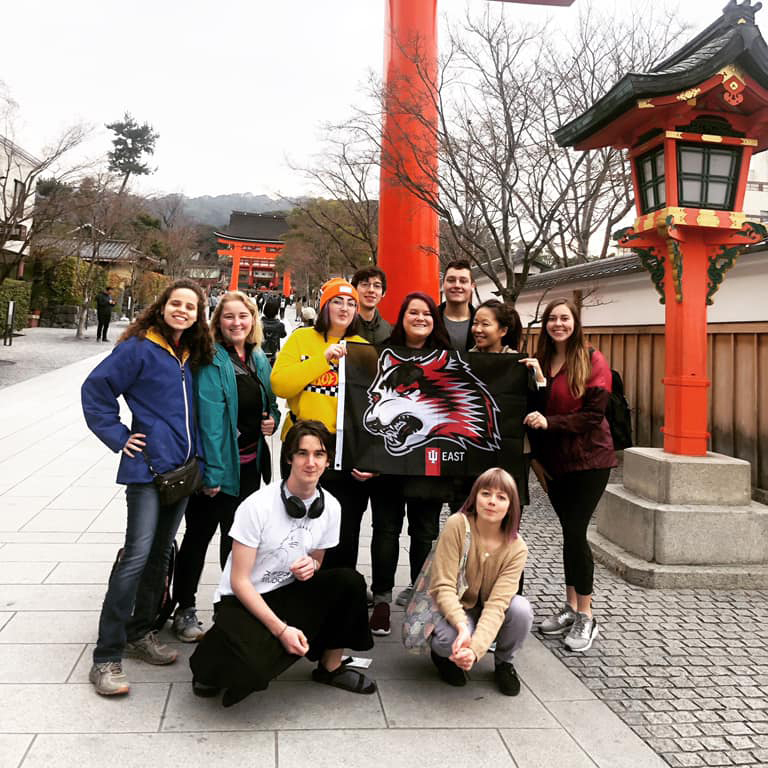The IU East Global Connections students pose in front of Japanese architecture and landscape