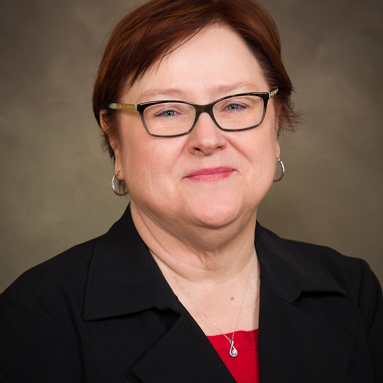 Close-up of Karen Clark over a neutral background