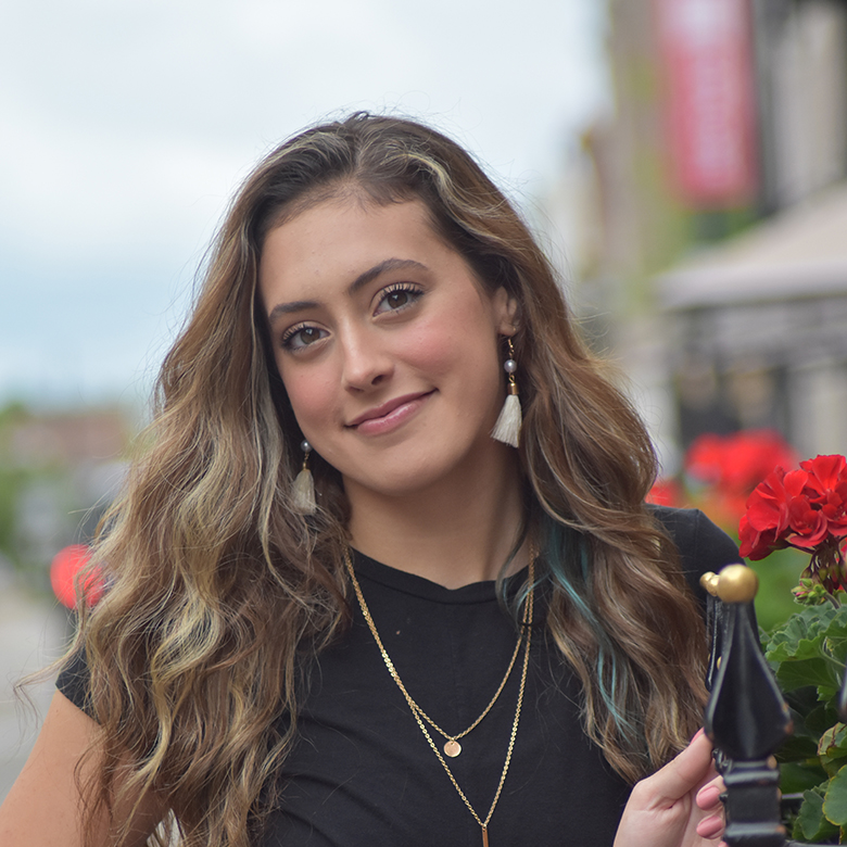 Sierra Searcy, outside, smiling at camera