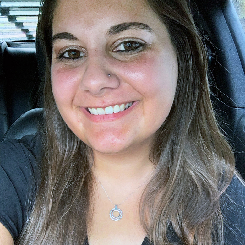 Close-up of Caysey Farmer sitting inside a vehicle