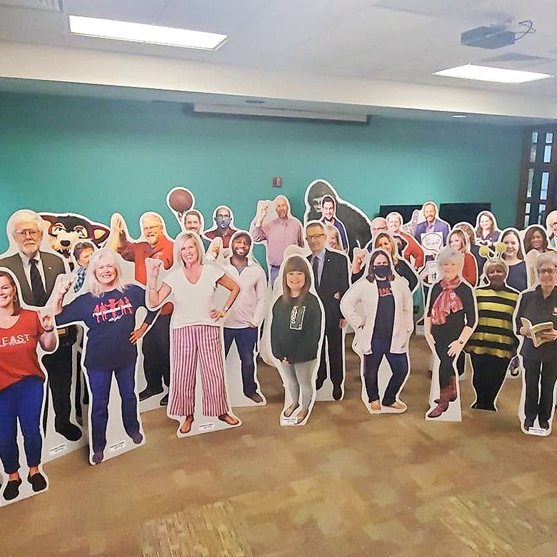 group photo of cardboard cutouts for People of the Pack
