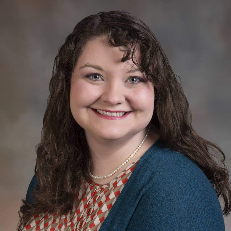 Katelyn Brown smiling over a neutral background