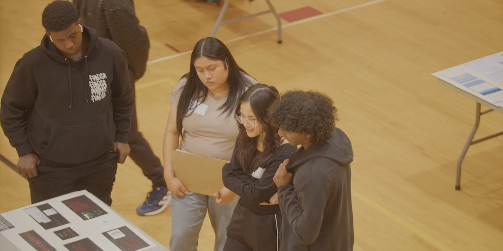 Mentors working with iDEW students