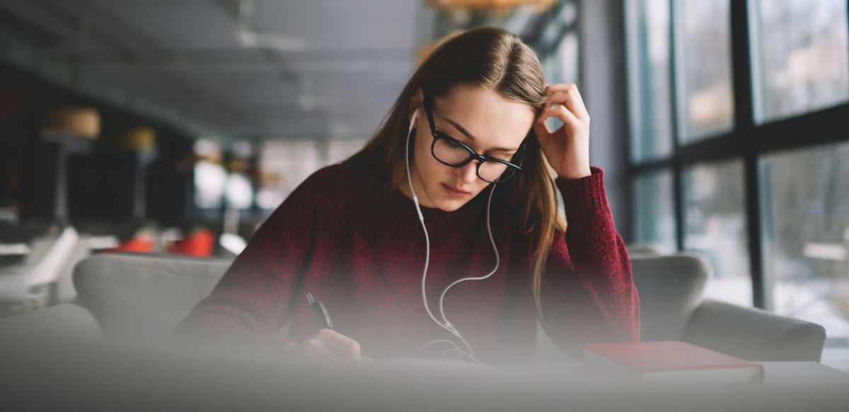 student listening to music while studying