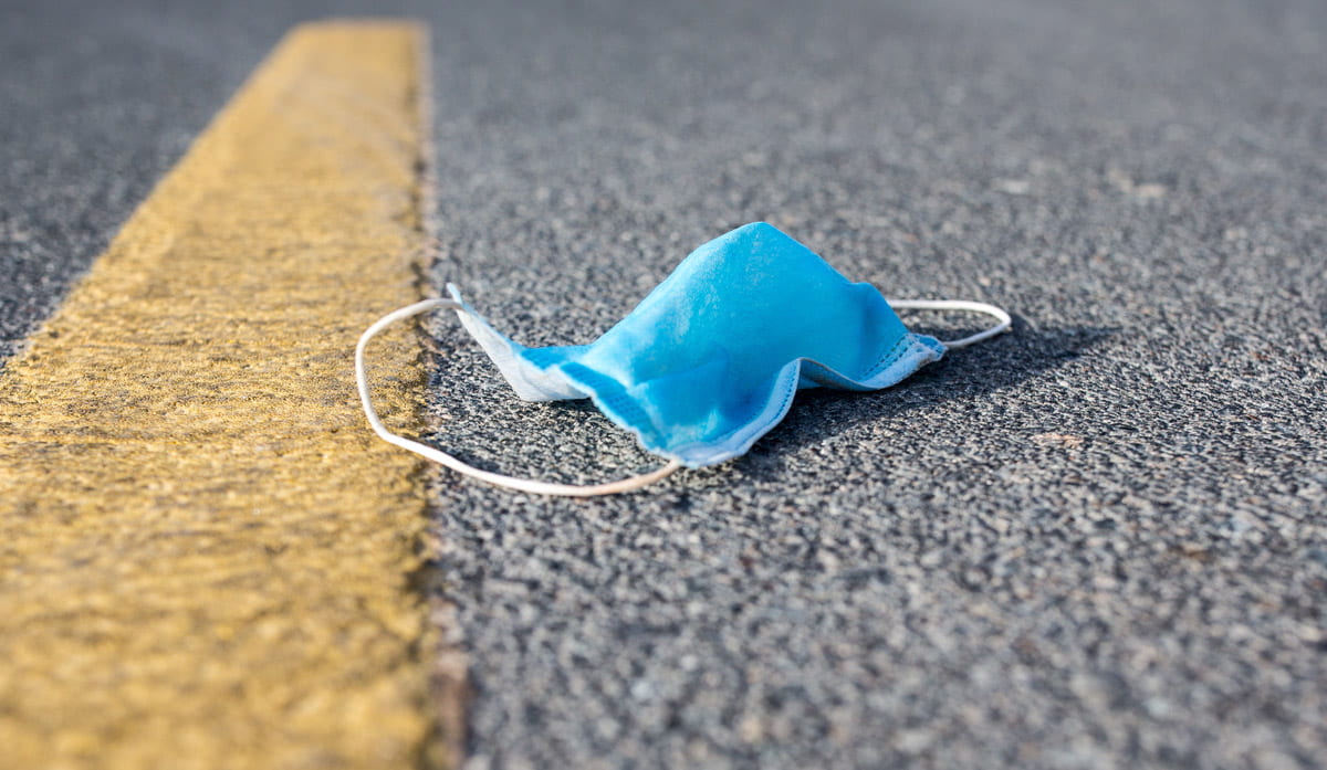 discarded mask lying in the street