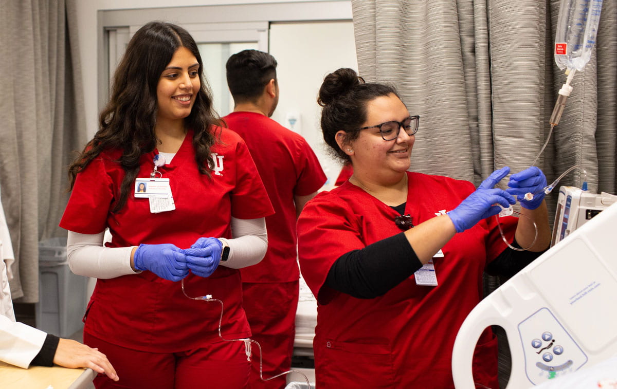 two nursing students going through training