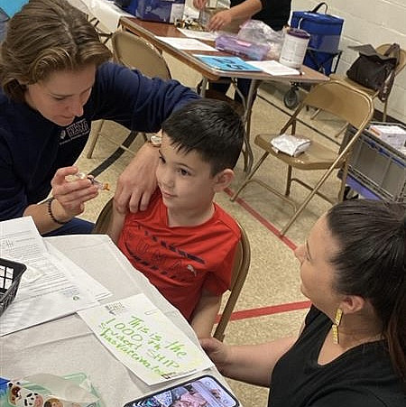 A Marion County student receives his immunizations through a clinic offered because of a partnership between Marion County Public Health ...