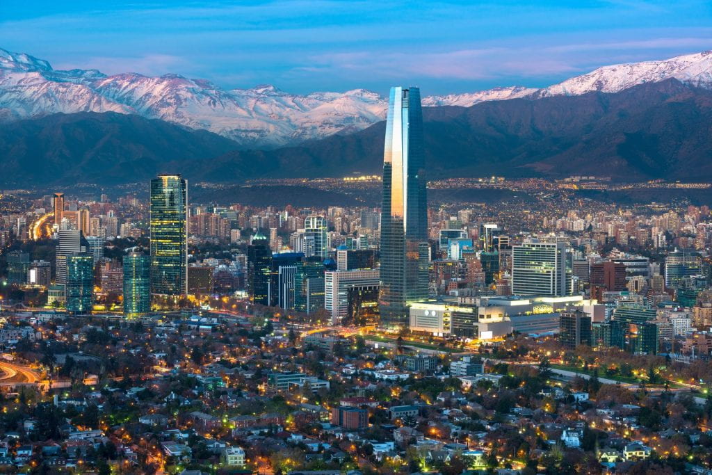 A landscape picture of the city of Santiago with mountains in the background