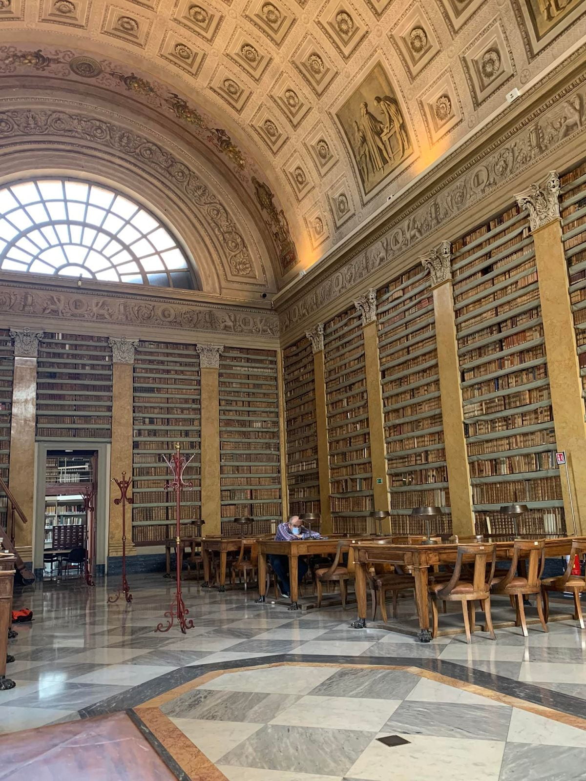Ornately decorated reading room of the Palatine Library in Parma, Italy