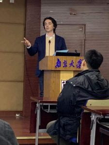 McAndrews addressing classmates at Nanjing University.