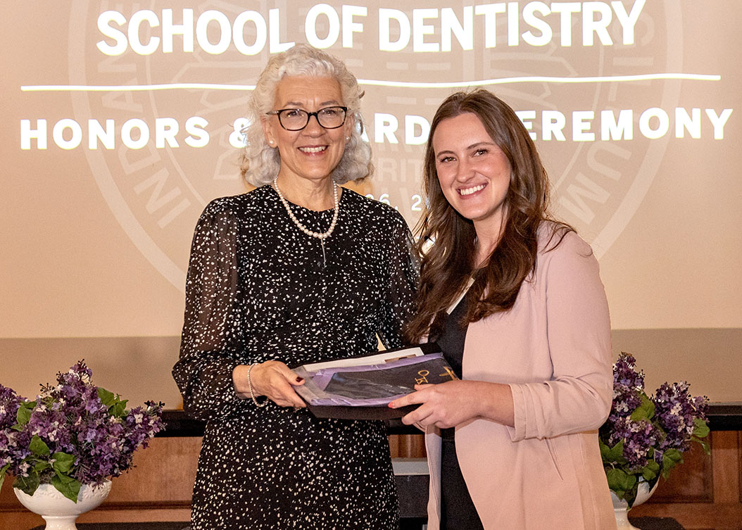 Dean Murdoch-Kinch congratulates D4 Class Secretary Brittney Gehlhausen, who was honored with numerous awards, including the Pierre Fauch...