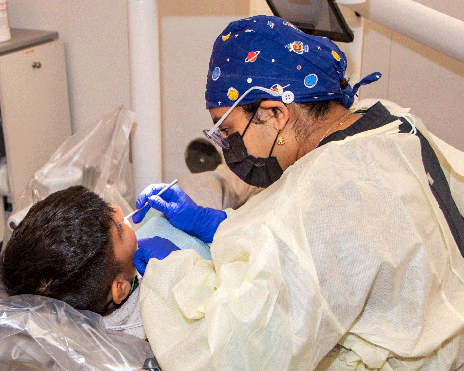 Student provides dental care to a child during Give Kids A Smile 2026