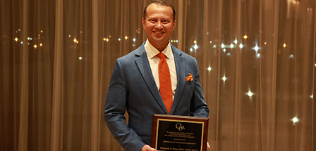 Dr. Khan displays his award during the ODA meeting. Photo: Ohio Dental Association