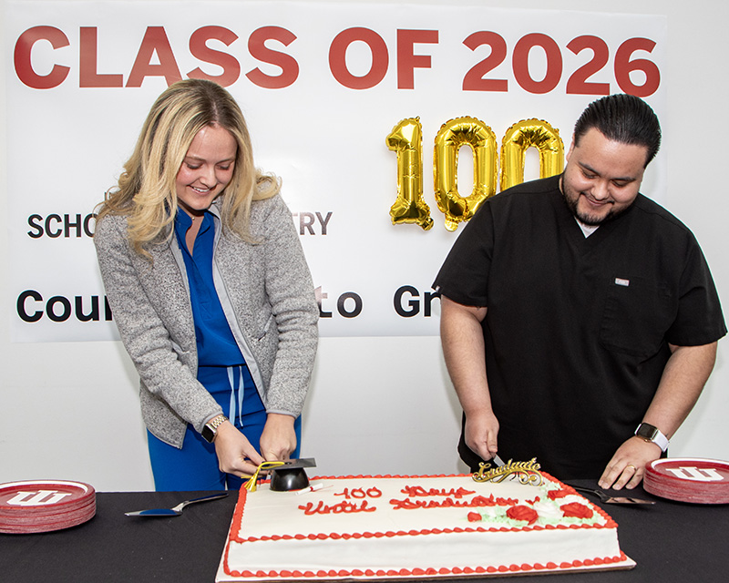 Class of 2026 Vice President Claire O'Reilly and President Jose Salcedo Hernandez II cut the celebratory cake.