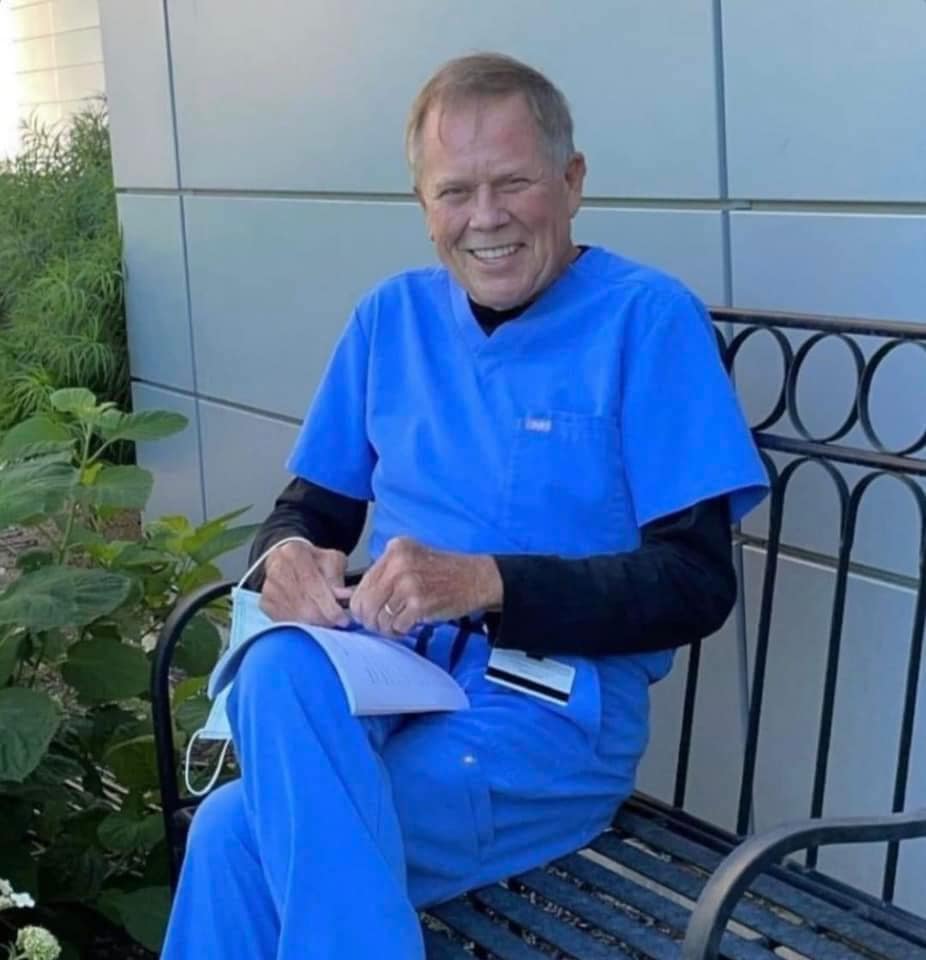 Dr. Sovanich in his garden outside the clinic.